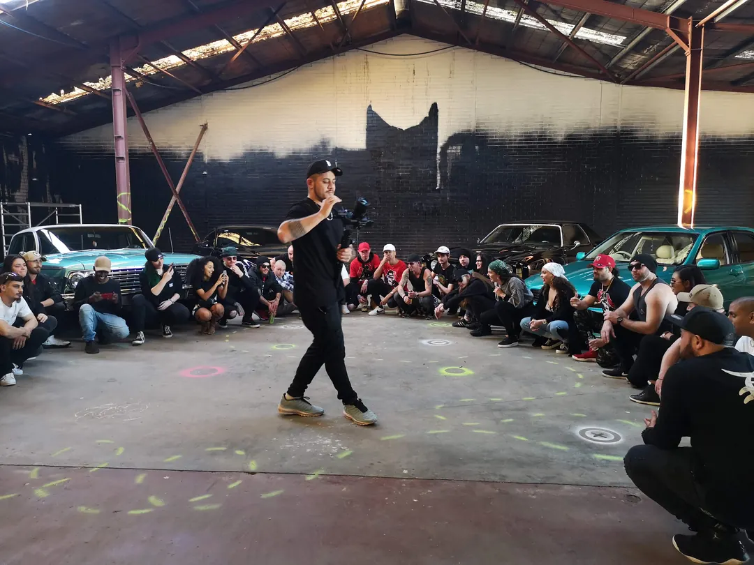 Filming a cypher in a warehouse