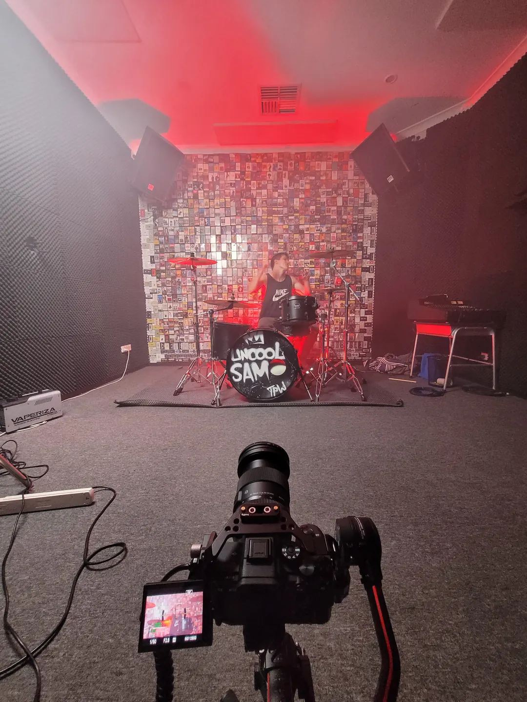 Filming a drummer in a rehearsal room